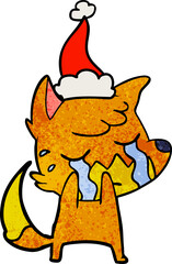crying fox hand drawn textured cartoon of a wearing santa hat