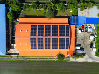 Top aerial view of solar roof system at the rooftop of factory warehouse. renewable energy of...