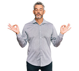 Middle age grey-haired man wearing casual clothes relax and smiling with eyes closed doing meditation gesture with fingers. yoga concept.