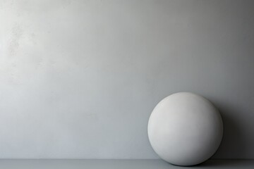 A white egg sitting on top of a table. This versatile image can be used in various contexts