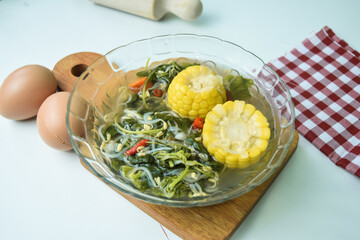 Close up of Sayur bening bayam, Spinach Clear Vegetable. Indonesian food of spinach, spinach soup with corn and chayote.