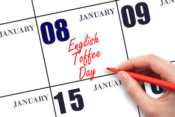 January 8. Hand writing text English Toffee Day on calendar date. Save the date.