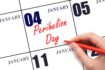 January 4. Hand writing text Perihelion Day on calendar date. Save the date.