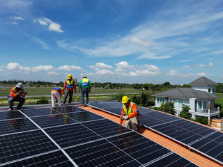 engineer man inspects construction of solar cell panel or photovoltaic cell at roof top. Industrial Renewable energy of green power. factory at urban area. worker working on tower roof.