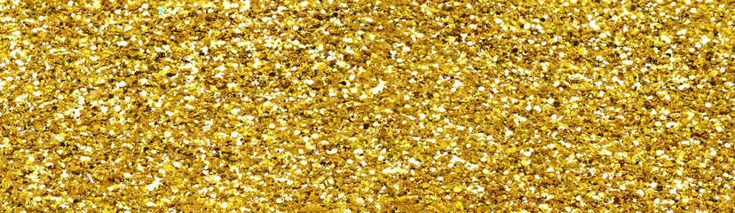 Gold glitter texture sparkling shiny background for Christmas card.  Twinkly golden  glitter lights...