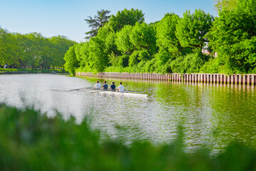Rowing Boat Racing on a Water River © Bento