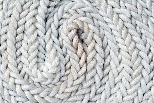 Boat rope, nautical rope coiled on the deckhouse of a sailboat. Nautical concept