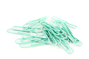 Heap of green paper clips on white background