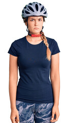 Beautiful caucasian woman wearing bike helmet skeptic and nervous, frowning upset because of problem. negative person.