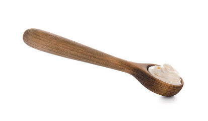 Wooden spoon with delicious yogurt on white background