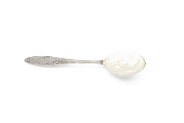 Metal spoon with tasty yogurt on white background