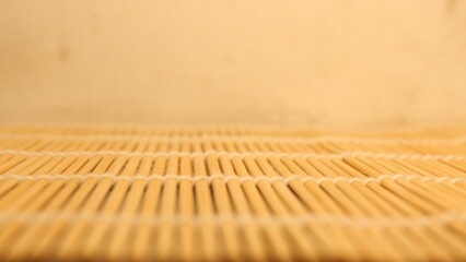 Bamboo Mat Texture Ground with a Plain Wall Background