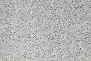 background wall painted with white paint with dried convex drops