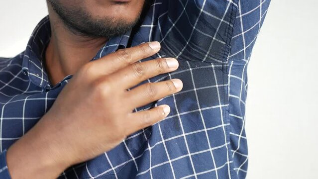 man with wet armpits Smelly odor from sweat .