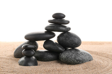 Fototapeta na wymiar Stack of zen stones on the sand isolated on white background.