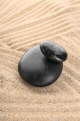 Zen stones on the sand, meditation and relaxation, harmony and balance concept