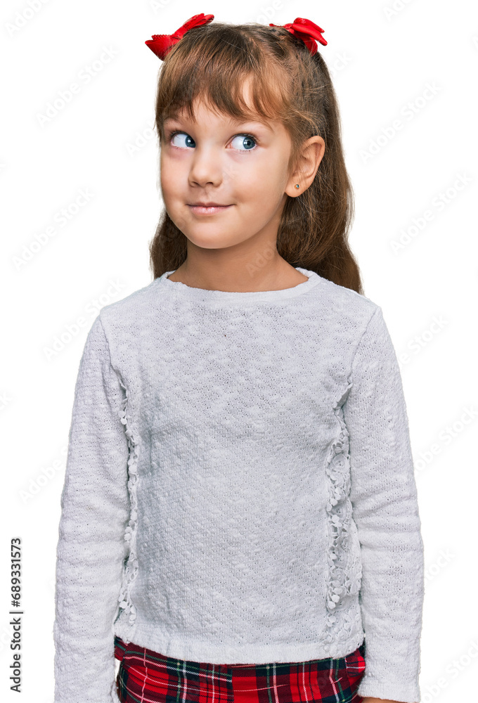 Wall mural Little caucasian girl kid wearing casual clothes smiling looking to the side and staring away thinking.