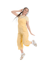 Young woman with dreadlocks in headphones jumping on white background