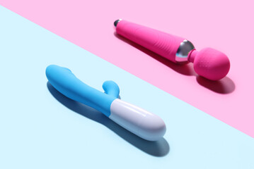 Vibrators on blue and pink background, closeup