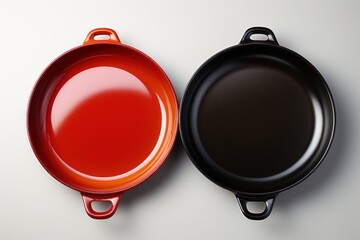 two frying pans sitting together on a white background - obrazy, fototapety, plakaty