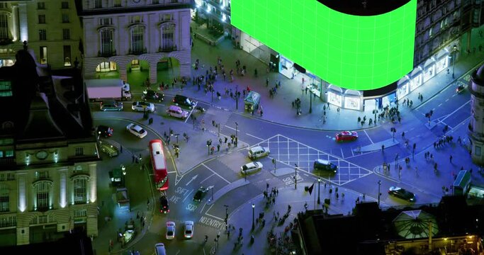 Establishment Aerial Overhead Shot of Piccadilly Circus in United Kingdom. Video Displays With Chroma Key.  Regent Street and Shaftesbury Ave, Full of People Traffic Cars And Double-Decker Buses
