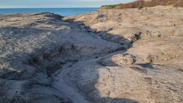 Walking over old coal mining residues. Kultippen Hasle, Bornholm island. Denmark.