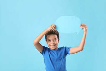 Little African-American boy with speech bubble on blue background