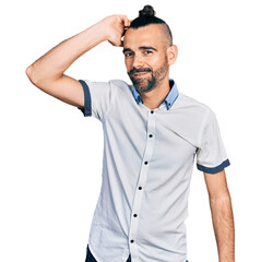 Hispanic man with ponytail wearing casual white shirt smiling confident touching hair with hand up gesture, posing attractive and fashionable