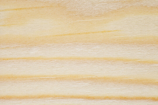 Wooden surface, close-up structure, processed, with horizontal parallel thin and wide yellow stripes, background