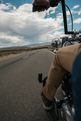 biker riding down highway