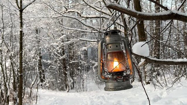 fantasy kerosene lantern shining in a snowy winter forest