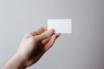 hand holding blank business card for mockup 