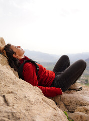 Digital detox and disconnection of a wild woman lying in nature