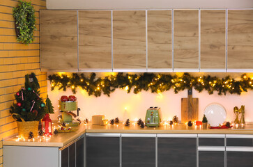 Interior of kitchen with counters, utensils and Christmas tree