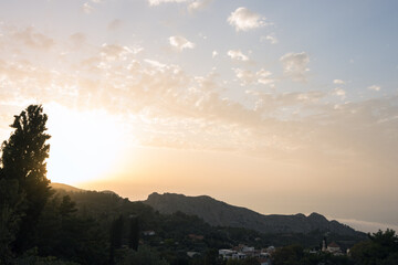 Gorgeous view to the mountain village of Christos Raches and the Halari canyon at sunset.