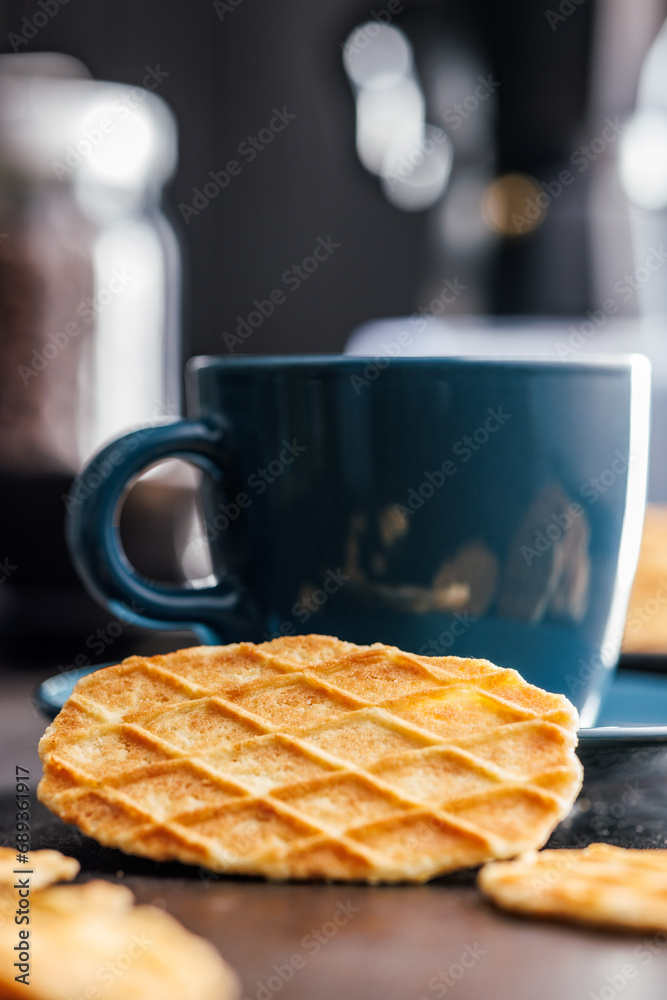 Poster round waffle biscuits on kitchen table.