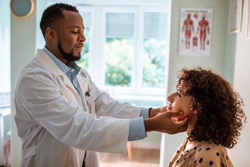 Young woman having a medical exam in the doctors office