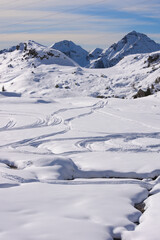 Fototapeta na wymiar Tracks in te fresh snow. Dordona pass (Italian: Passo di Dordona). Foppolo, Lombardy, Italy