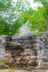 Coba Maya Ruins ancient buildings pyramids in tropical jungle Mexico.