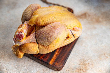 chicken raw meat whole poultry  farm product organic meat bio healthy eating cooking appetizer meal food snack on the table copy space food background rustic top view