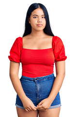 Fototapeta premium Young beautiful asian girl wearing casual clothes depressed and worry for distress, crying angry and afraid. sad expression.