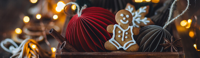 Banner. Cozy atmospheric photo with homemade gingerbread man, home festive atmosphere. Collection...
