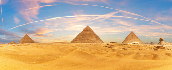 Picturesque panorama of the Pyramids and the Sphinx in the Giza desert near Cairo, Egypt - obrazy, fototapety, plakaty