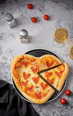 Pepperoni pizza in the shape of a heart for Valentine's Day holiday