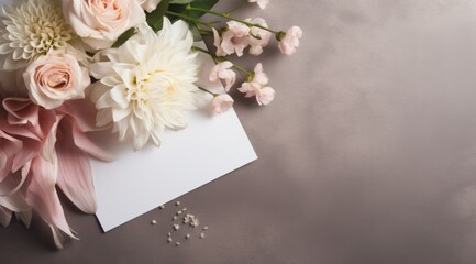 white flower bouquet and blank card on a concrete background,