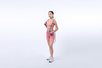 Young energetic asian woman in sportswear with jumping or skipping robe posing portrait in studio...