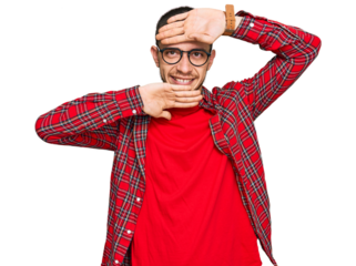 Hispanic young man wearing casual clothes smiling cheerful playing peek a boo with hands showing face. surprised and exited