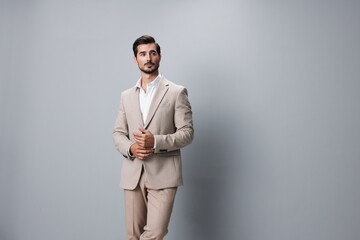 copyspace man beige businessman studio happy handsome business suit smiling portrait