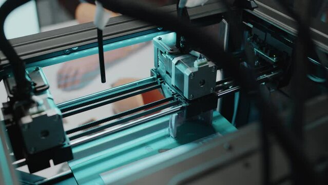 Close-up shot of inside of 3D printing machine making new custom prosthetic limb
