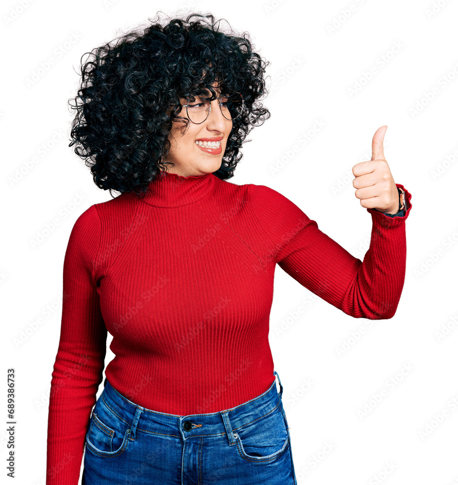 Canvas Prints Young middle east girl wearing casual clothes and glasses looking proud, smiling doing thumbs up gesture to the side